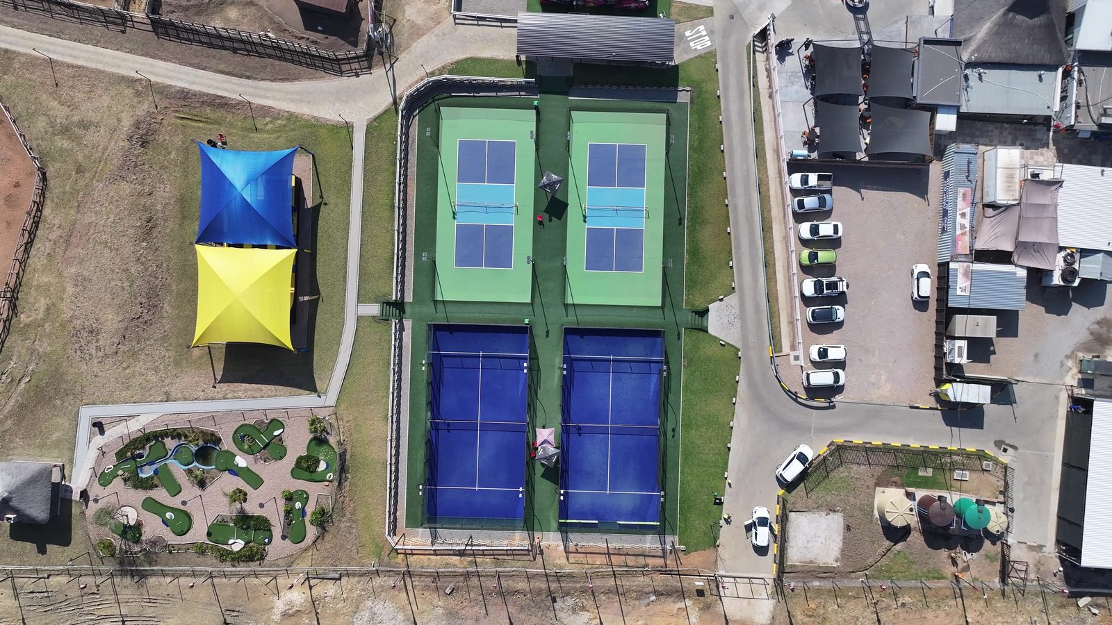 Courts with the yellow shade sail from above