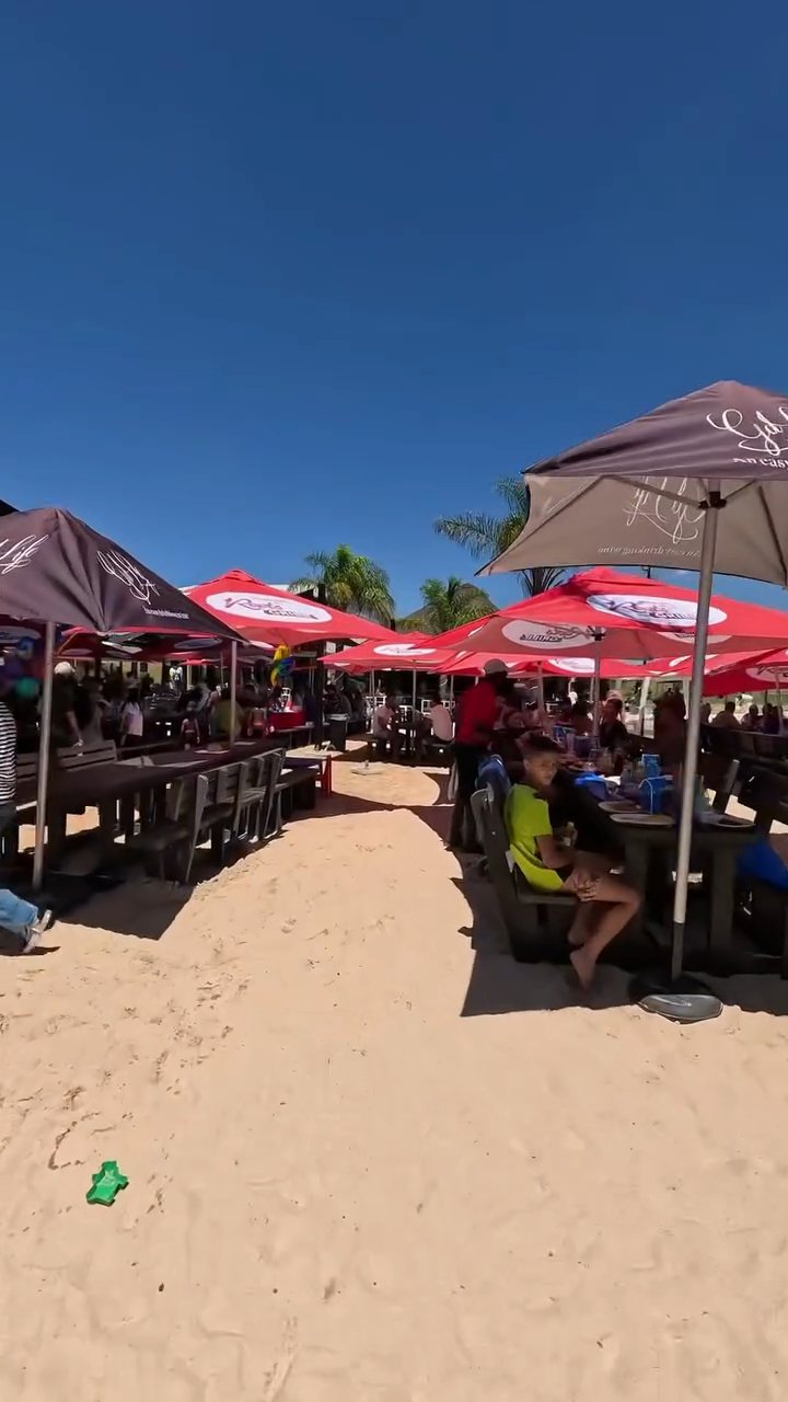 Umbrella deck seating on a busy day