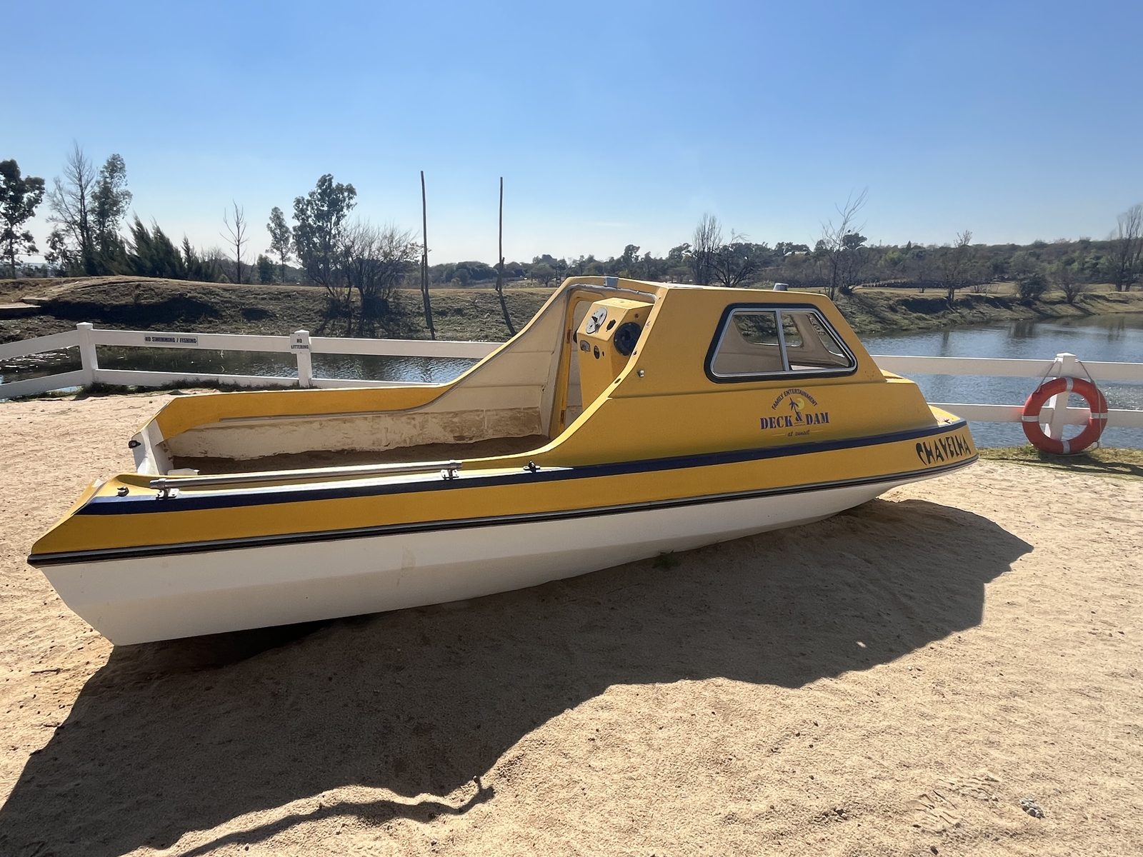 Paddle boats on the beach by the dam