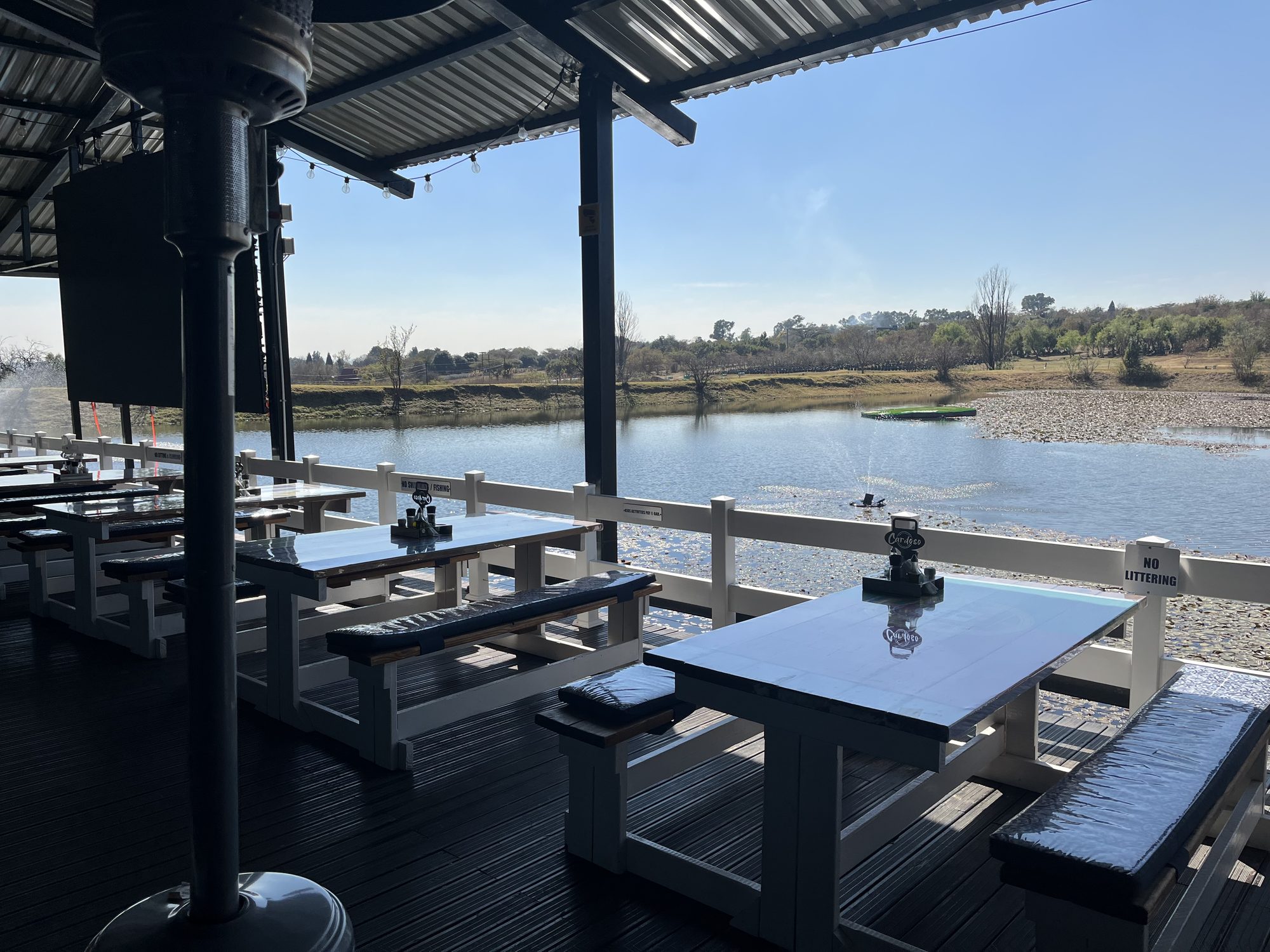Dining tables on the deck right over the dam